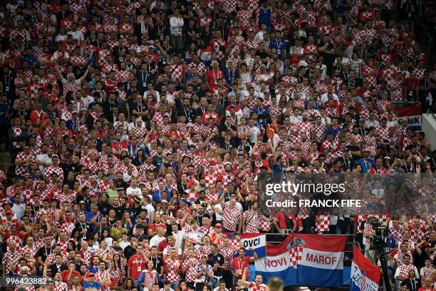 Croatia supporters watch the Russia 2018 World Cup semi-final football match between Croatia and England at the Luzhniki Stadium in Moscow on July...