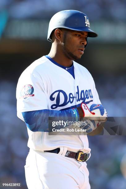 Yasiel Puig of the Los Angeles Dodgers reacts during the game against the San Francisco Giants at Dodger Stadium on Thursday, March 29, 2018 in Los...