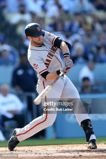 Evan Longoria of the San Francisco Giants bats during the game against the Los Angeles Dodgers at Dodger Stadium on Thursday, March 29, 2018 in Los...