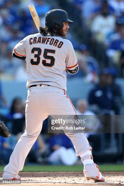 Brandon Crawford of the San Francisco Giants bats during the game against the Los Angeles Dodgers at Dodger Stadium on Thursday, March 29, 2018 in...