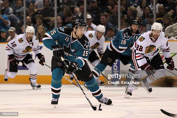 Dany Heatley of the San Jose Sharks moves the puck while taking on the Chicago Blackhawks in Game One of the Western Conference Finals during the...