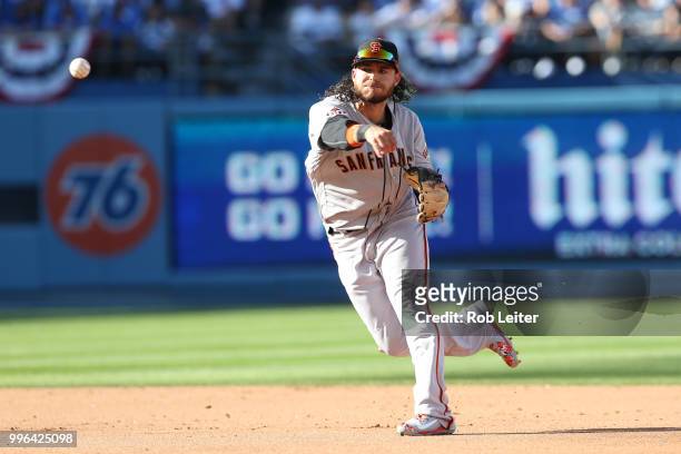 Brandon Crawford of the San Francisco Giants throws to first during the game against the Los Angeles Dodgers at Dodger Stadium on Thursday, March 29,...
