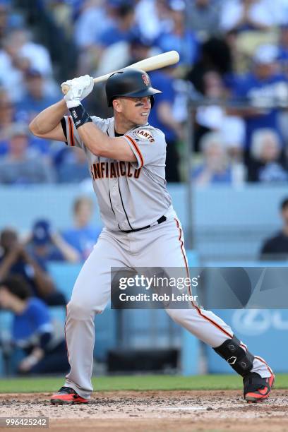 Buster Posey of the San Francisco Giants bats during the game against the Los Angeles Dodgers at Dodger Stadium on Thursday, March 29, 2018 in Los...