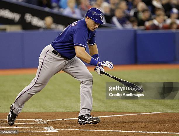 Ian Kinsler of the Texas Rangers takes off after a hit during a MLB game against the Toronto Blue Jaysat the Rogers Centre May 15, 2010 in Toronto,...