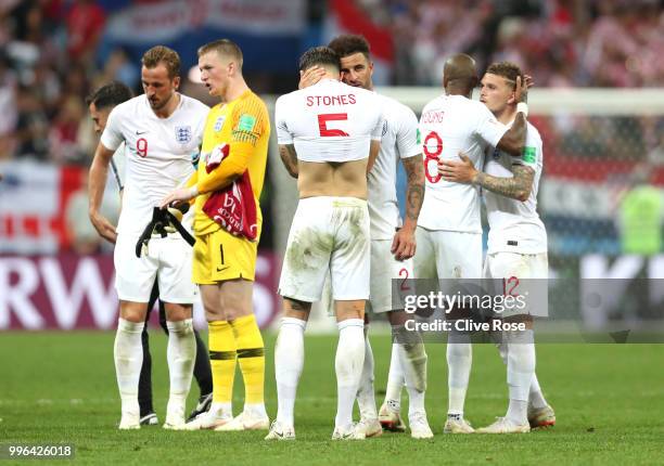 Harry Kane of England and Jordan Pickford of England prepare for extra time during the 2018 FIFA World Cup Russia Semi Final match between England...