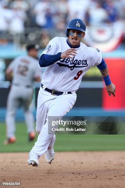 Yasmani Grandal of the Los Angeles Dodgers runs during the game against the San Francisco Giants at Dodger Stadium on Thursday, March 29, 2018 in Los...