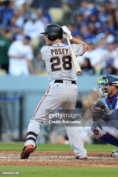 Buster Posey of the San Francisco Giants bats during the game against the Los Angeles Dodgers at Dodger Stadium on Thursday, March 29, 2018 in Los...