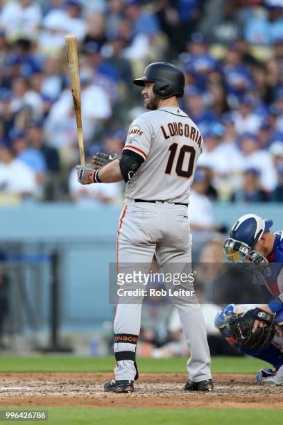 Evan Longoria of the San Francisco Giants bats during the game against the Los Angeles Dodgers at Dodger Stadium on Thursday, March 29, 2018 in Los...
