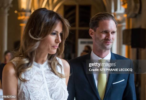 First Lady Melania Trump and Husband of Luxembourg's pime minister Gauthier Destenay are pictured ahead of NATO spouses dinner at Jubilee Museum in...