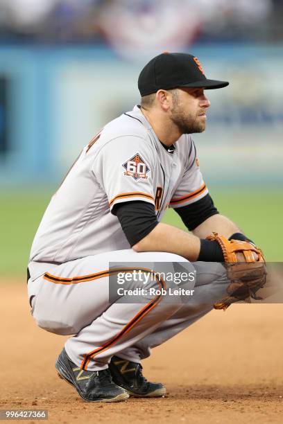 Evan Longoria of the San Francisco Giants looks on during the game against the Los Angeles Dodgers at Dodger Stadium on Thursday, March 29, 2018 in...