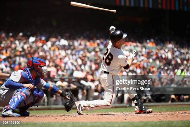 Buster Posey of the San Francisco Giants loses his bat as he strikes out in the first inning against the Chicago Cubs at AT&T Park on July 11, 2018...