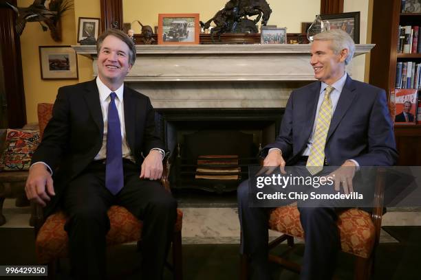 Judge Brett Kavanaugh and Sen. Rob Portman pose for photographs before a meeting in the Russell Senate Office Building on Capitol Hill July 11, 2018...