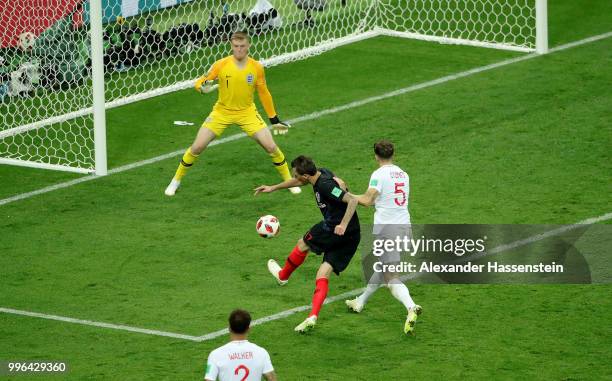 Mario Mandzukic of Croatia scores past Jordan Pickford of England his team's second goal during the 2018 FIFA World Cup Russia Semi Final match...