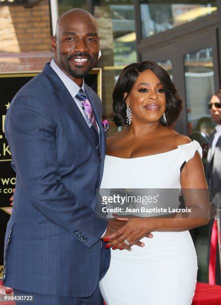 Niecy Nash and Jay Tucker attend a ceremony honoring her with Star on The Hollywood Walk Of Fame on July 11, 2018 in Los Angeles, California.