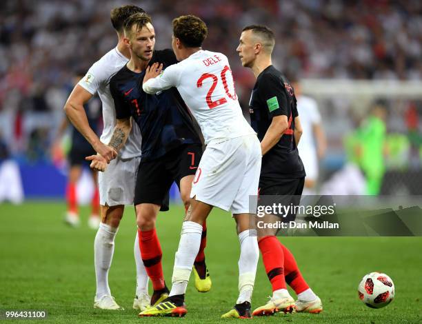 Ivan Rakitic of Croatia and Dele Alli of England clash during the 2018 FIFA World Cup Russia Semi Final match between England and Croatia at Luzhniki...