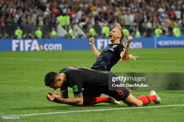 Domagoj Vida of Croatia celebrates following his sides victory in the 2018 FIFA World Cup Russia Semi Final match between England and Croatia at...