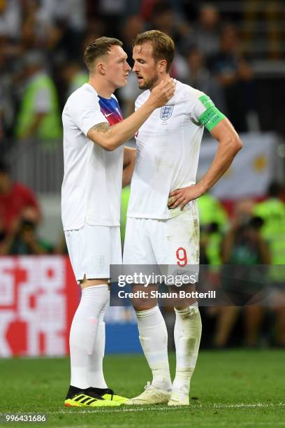 Phil Jones of England consoles Harry Kane of England following their sides defeat in the 2018 FIFA World Cup Russia Semi Final match between England...