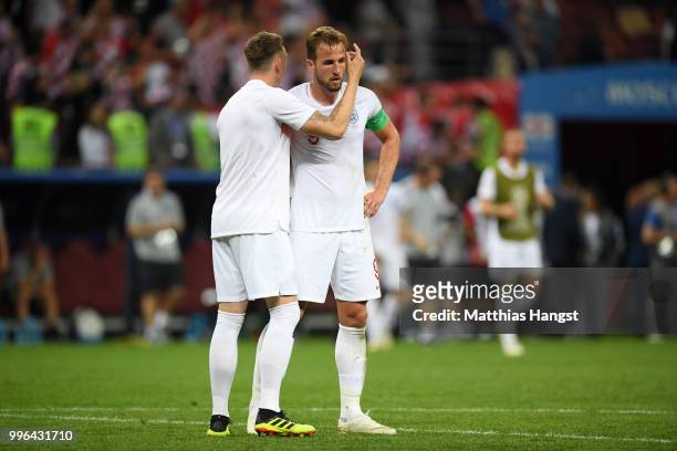 Phil Jones of England consoles Harry Kane of England following their sides defeat in the 2018 FIFA World Cup Russia Semi Final match between England...