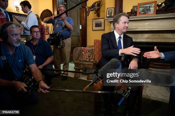 Judge Brett Kavanaugh shakes hands with Sen. Rob Portman before a meeting in the Russell Senate Office Building on Capitol Hill July 11, 2018 in...