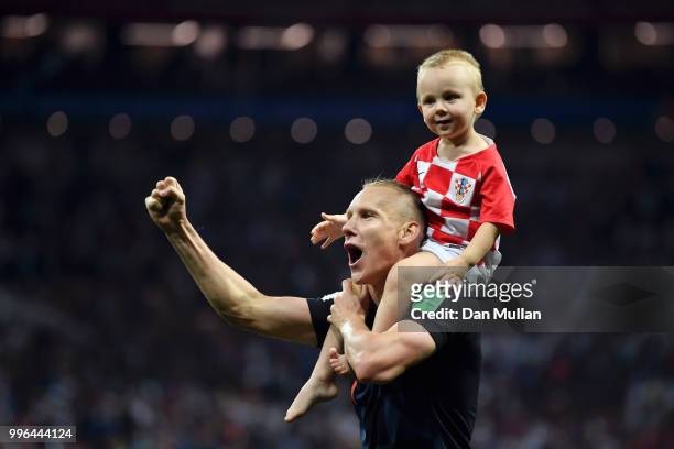 Domagoj Vida of Croatia celebrates with his son following his sides victory in the 2018 FIFA World Cup Russia Semi Final match between England and...