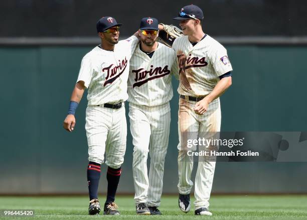 Eddie Rosario, Jake Cave and Max Kepler of the Minnesota Twins celebrate defeating the Kansas City Royals after the game on July 11, 2018 at Target...