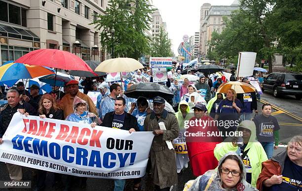 Activists with the National People's Action group march through the streets of Washington on May 17, 2010 as they protest Wall Street, banks and...