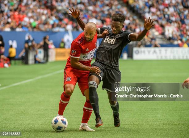 Kevin Ellis of the Chicago Fire and Alphonso Davies of the Vancouver Whitecaps FC at BC Place on July 7, 2018 in Vancouver, Canada.