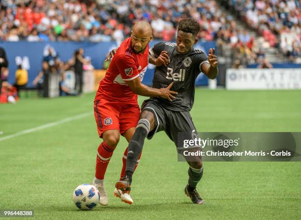 Kevin Ellis of the Chicago Fire and Alphonso Davies of the Vancouver Whitecaps FC at BC Place on July 7, 2018 in Vancouver, Canada.