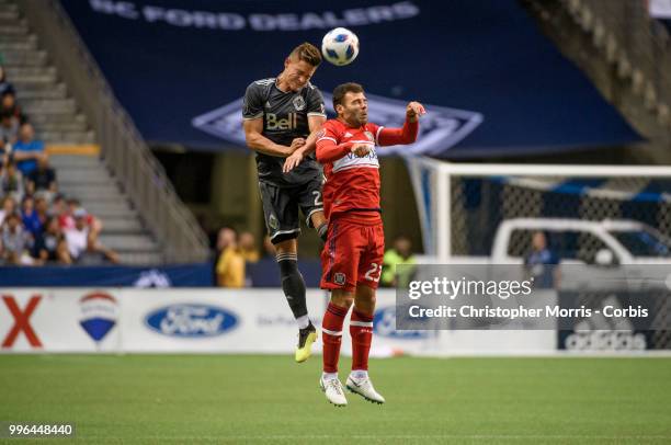 Jake Nerwinski of the Vancouver Whitecaps FC heads the ball over Nemanja Nikolic of the Chicago Fire at BC Place on July 7, 2018 in Vancouver, Canada.