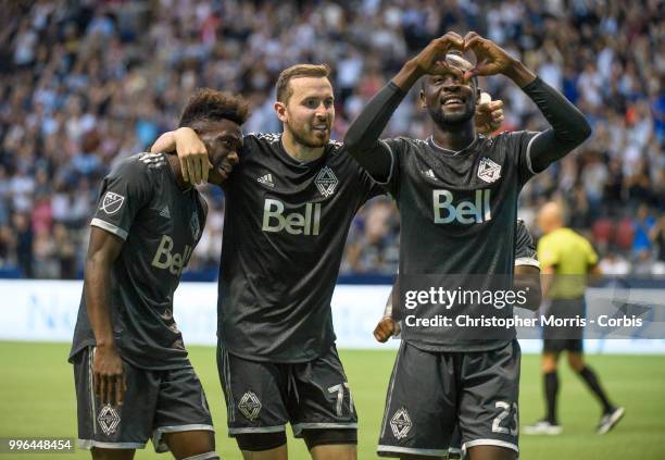 Alphonso Davies of the Vancouver Whitecaps FC , Jordon Mutch of the Vancouver Whitecaps FC and Kei Kamara of the Vancouver Whitecaps FC celebrate...