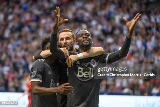 Alphonso Davies of the Vancouver Whitecaps FC , Jordon Mutch of the Vancouver Whitecaps FC and Kei Kamara of the Vancouver Whitecaps FC celebrate...