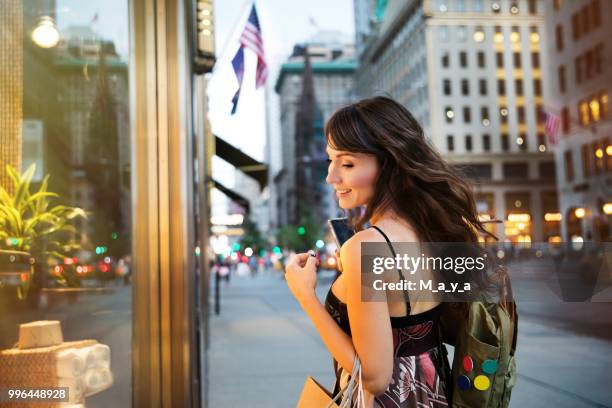 walking down fifth avenue - money to burn stock pictures, royalty-free photos & images