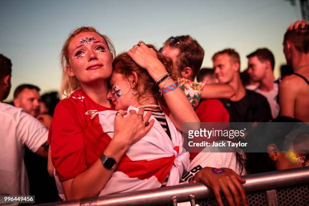 England football fans react after their defeat as they watch the Hyde Park screening of the FIFA 2018 World Cup semi-final match between Croatia and...