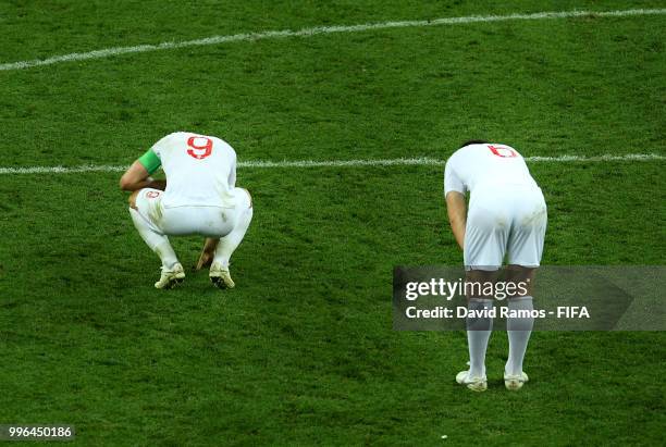 Harry Maguire and Harry Kane of England show their dejection following the 2018 FIFA World Cup Russia Semi Final match between England and Croatia at...