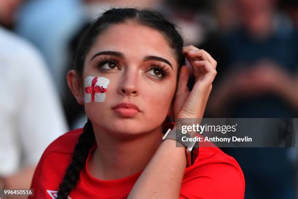 Football fans react as they watch England lose to Croatia at the Auto Trader World Cup semi-final screening in Castlefield Bowl on July 11, 2018 in...