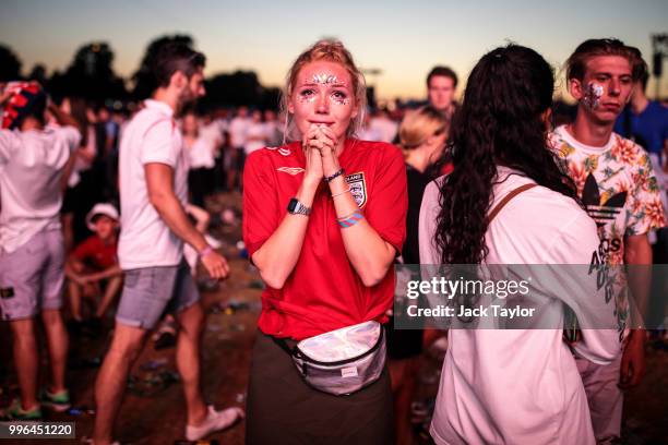 England football fans react after their defeat as they watch the Hyde Park screening of the FIFA 2018 World Cup semi-final match between Croatia and...