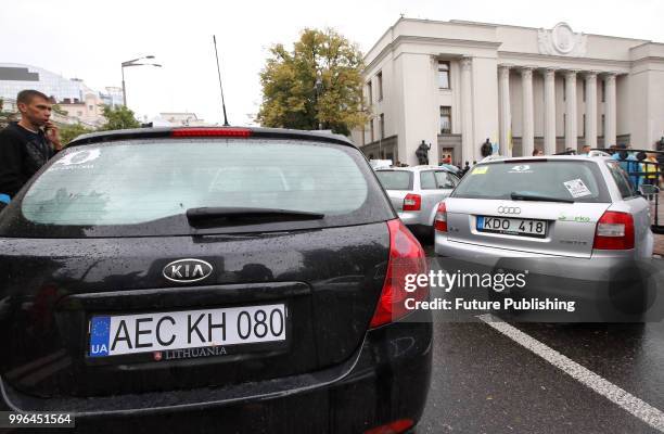 Cars registered abroad block Hrushevskoho Street outside the Verkhovna Rada building during a rally for the adoption of a draft bill on customs...