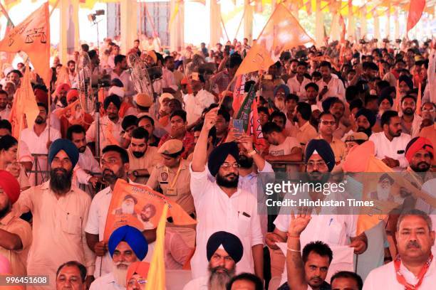 And BJP workers during 'thanksgiving' rally of farmers at Malout in Muktsar on July 11, 2018 near Bhatinda, India. Prime Minister Narendra Modi...