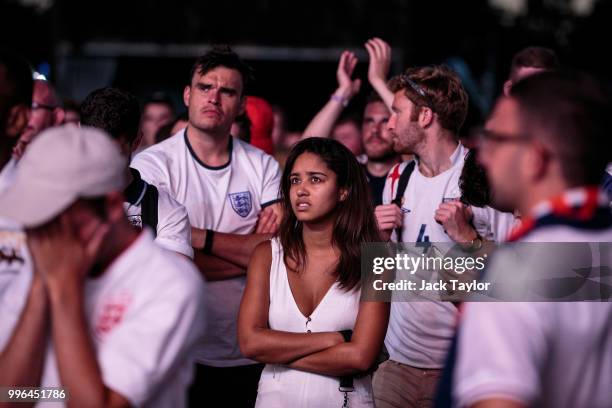 England football fans react after their defeat as they watch the Hyde Park screening of the FIFA 2018 World Cup semi-final match between Croatia and...