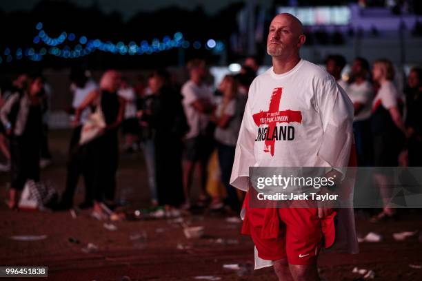 England football fans react after their defeat as they watch the Hyde Park screening of the FIFA 2018 World Cup semi-final match between Croatia and...