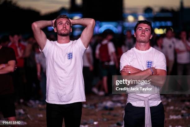 England football fans react after their defeat as they watch the Hyde Park screening of the FIFA 2018 World Cup semi-final match between Croatia and...