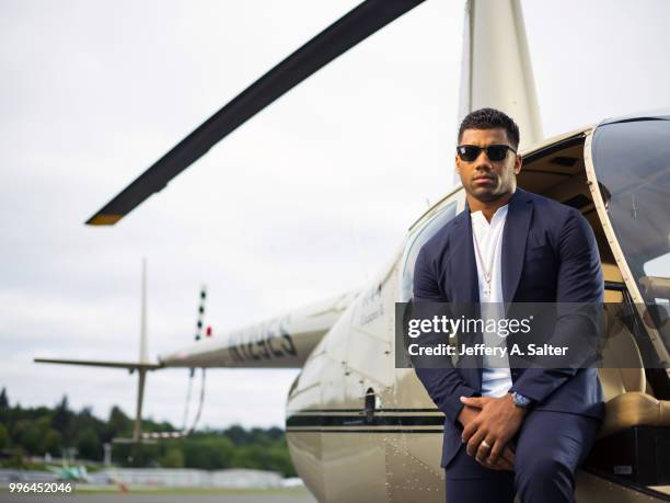 Fashionable 50: Portrait of Seattle Seahawks QB Russell Wilson posing during photo shoot at Clay Lacy Aviation. Seattle, WA 5/16/2018 CREDIT: Jeffery...