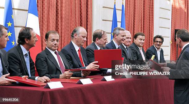 Intermarche hypermarket group representative Vincent Bronsard , French Leclerc hypermarket chain president Michel-Edouard Leclerc , Casino...