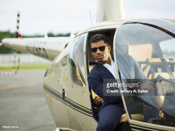 Fashionable 50: Portrait of Seattle Seahawks QB Russell Wilson posing during photo shoot at Clay Lacy Aviation. Seattle, WA 5/16/2018 CREDIT: Jeffery...