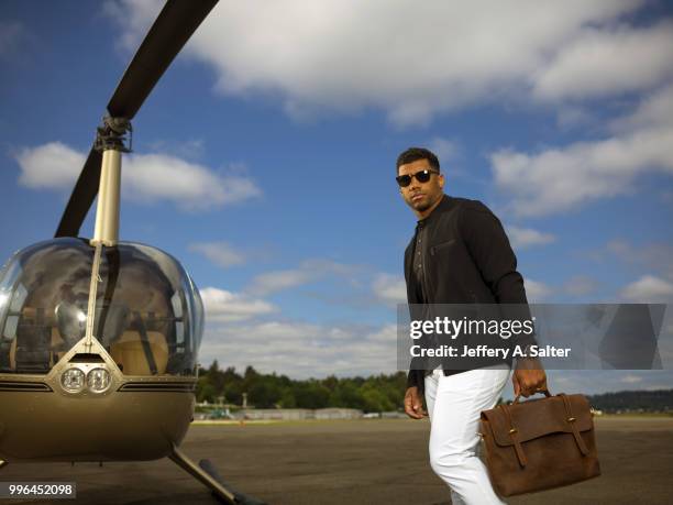 Fashionable 50: Portrait of Seattle Seahawks QB Russell Wilson posing during photo shoot at Clay Lacy Aviation. Seattle, WA 5/16/2018 CREDIT: Jeffery...