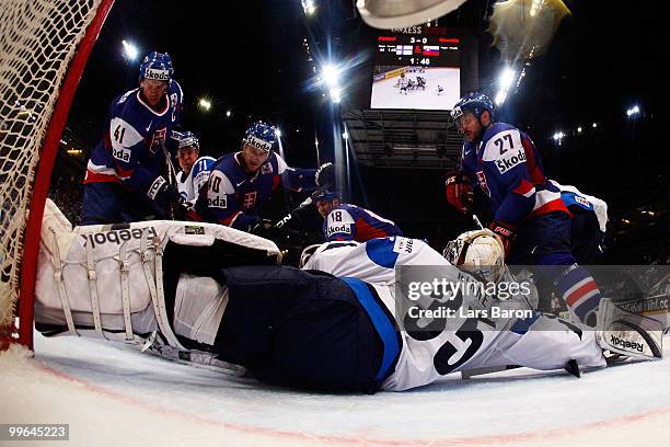 Goalie Pekka Rinne of Finland is challenged by Richard Lintner, Marek Svatos, Miroslav Satan and Ivan Ciernik of Slovakia during the IIHF World...