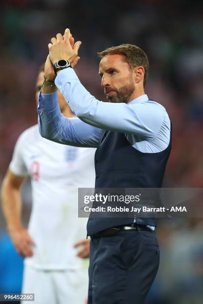 Gareth Southgate head coach / manager of England applauds the fans at the end of extra time during the 2018 FIFA World Cup Russia Semi Final match...