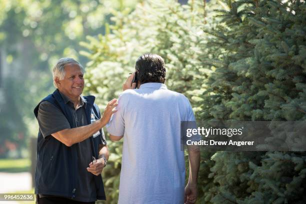 Leslie 'Les' Moonves, president and chief executive officer of CBS Corporation, greets Haim Saban, chairman of Univision Communications and chief...