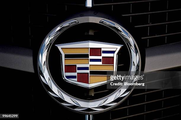 General Motors Co. 2010 Cadillac SRX luxury crossover sits on display at a Buick-Pontiac-GMC-Cadillac dealership in Raleigh, North Carolina, U.S., on...