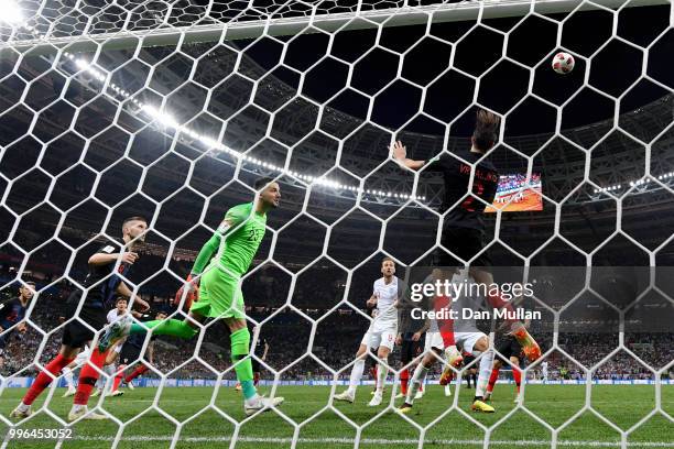 Sime Vrsaljko of Croatia clears of the line from a header from John Stones of England during the 2018 FIFA World Cup Russia Semi Final match between...